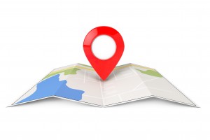 Folded Abstract Navigation Map with Target Pin on a white background